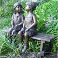 two children sitting on bench reading bronze statue sculpture